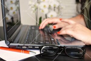 person woman desk laptop